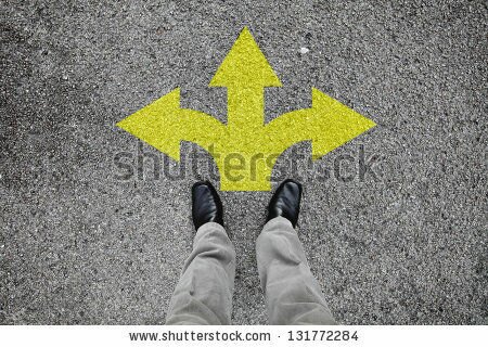 Zoom: stock-photo-a-pair-of-feet-standing-on-a-tarmac-road-with-yellow-arrow-print-pointing-in-three-different-131772284.jpg